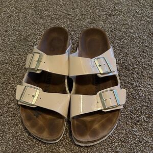 Birkenstock Beige Sandals with Metallic Buckles